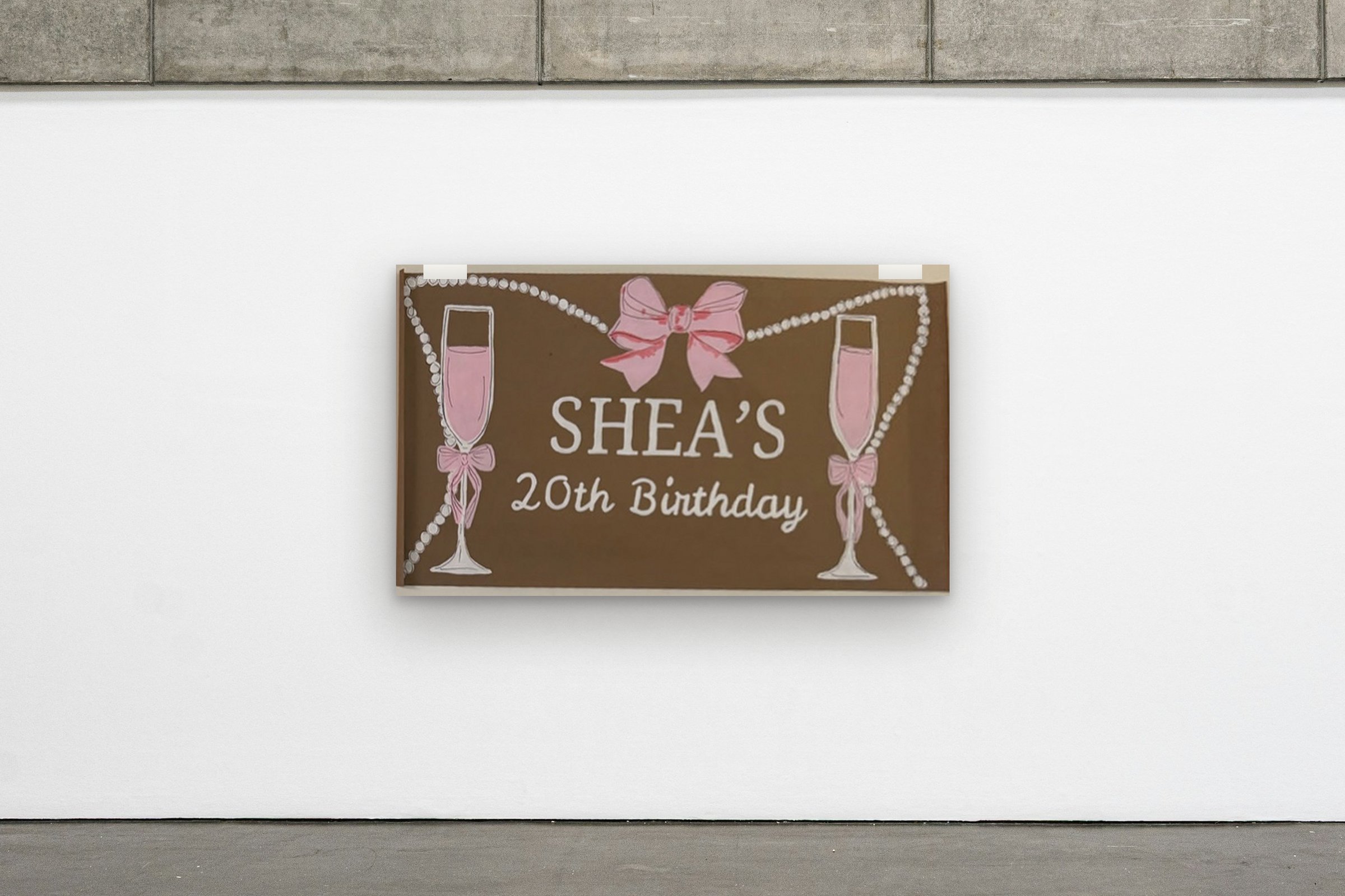 Bows & Pearls hung on a gallery wall