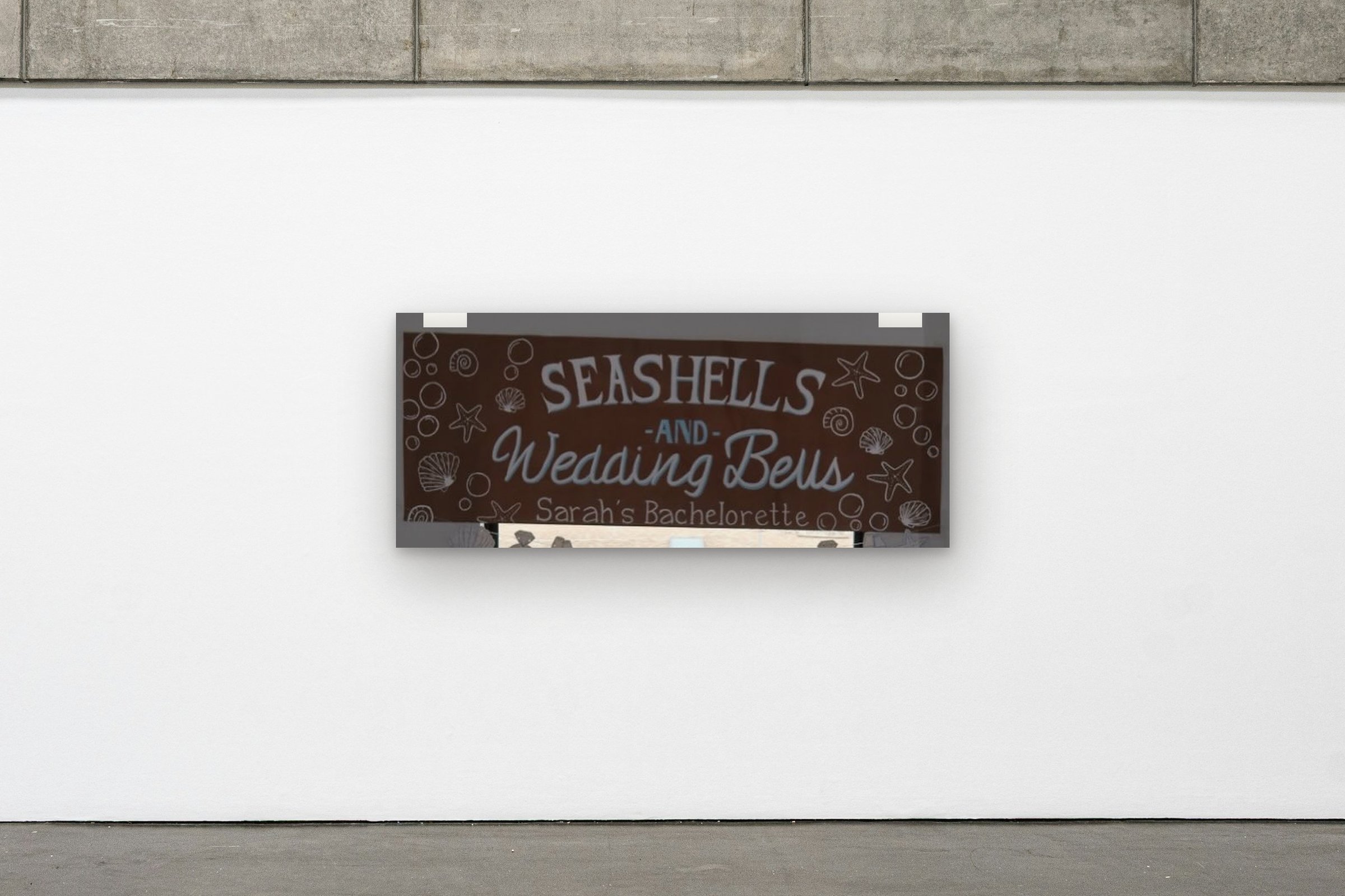 Seashells & Wedding Bells hung on a gallery wall